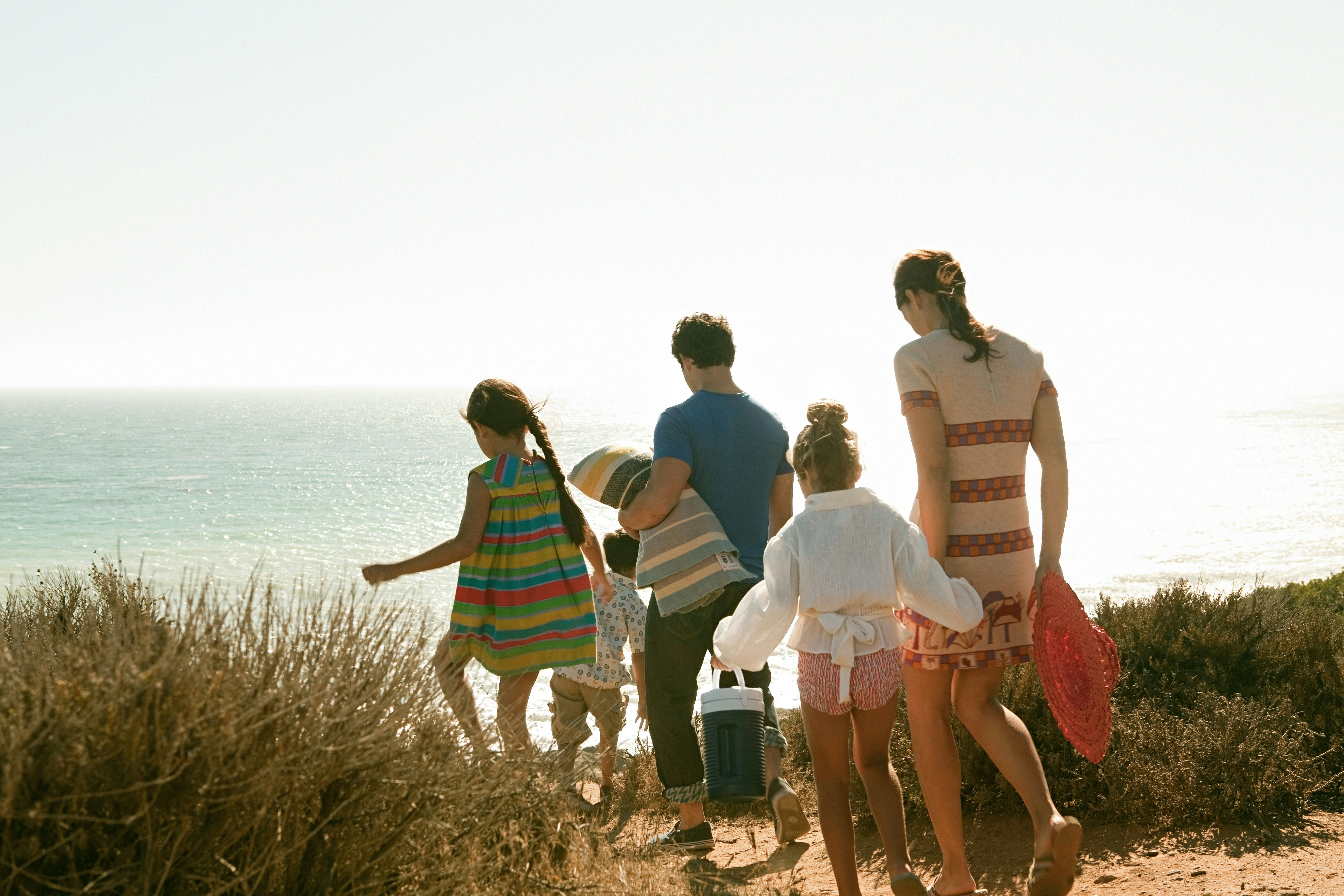 Family walking to the beach