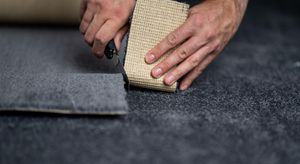 Flooring Contractor Cutting Carpet