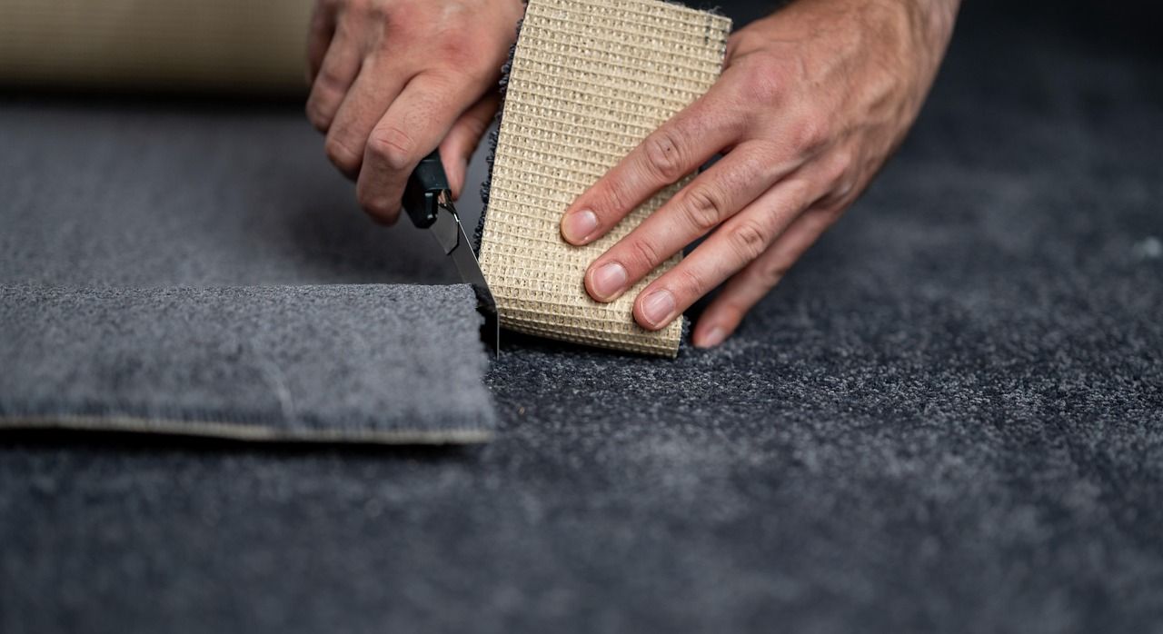 Flooring Contractor Cutting Carpet